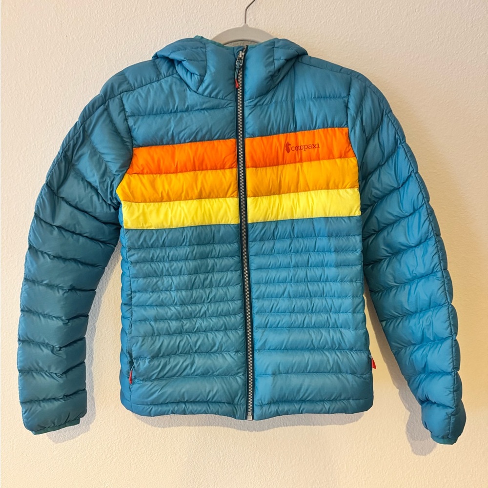 Cotopaxi Blue Jacket with Orange and Yellow Accents